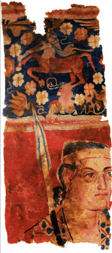 Woolen tapestry fragment from Sampul (Xinjiang) possibly showing a Greek soldier with a spear and diadem, with a centaur motif above.