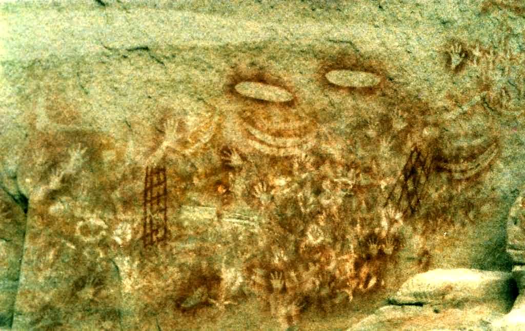 Indigenous Australian Dreaming rock art panel in Carnarvon Gorge showing ancestral figures and symbols.