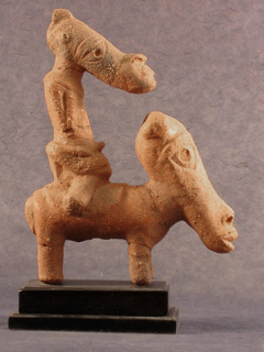 Terracotta figurine from the Nok culture showing a man riding a horse, an ancient Nigerian clay sculpture reflecting human and animal forms in Nok art.