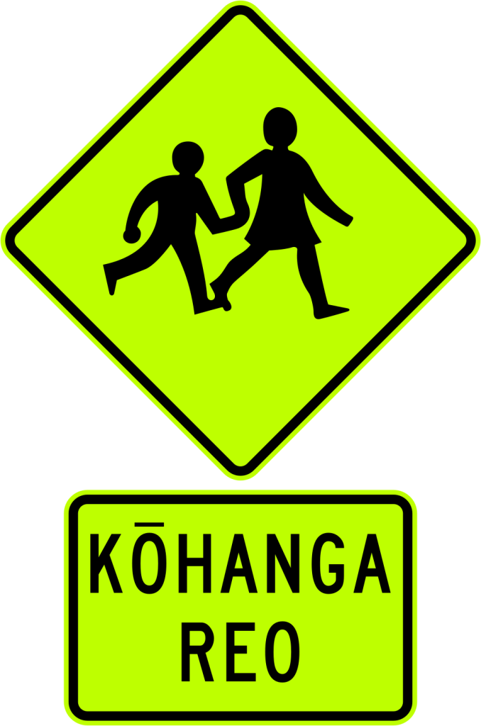 New Zealand bilingual road sign showing directions to Ōtara and Manukau, illustrating Māori language presence in public signage.