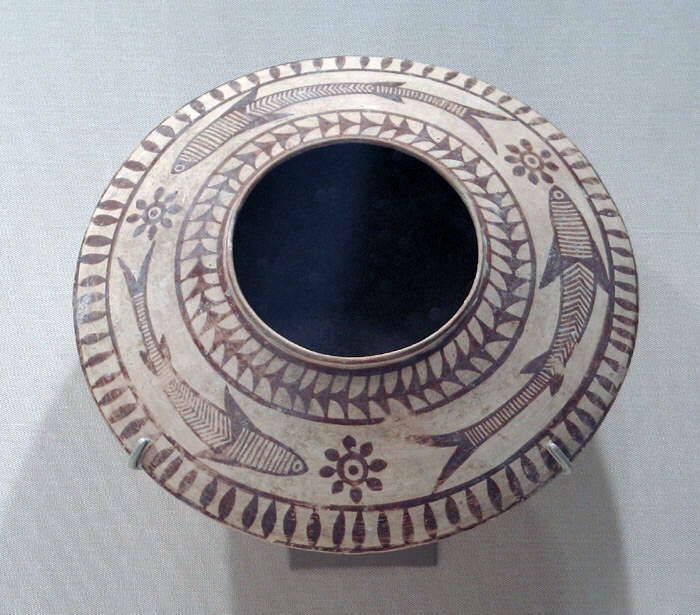 A painted ceramic vessel from the Indus Valley region in present‑day Baluchistan, decorated with fish motifs and dating to about 3000–2500 BCE, reflecting pottery styles in the ancient Indus civilization and early village cultures such as Mehrgarh.