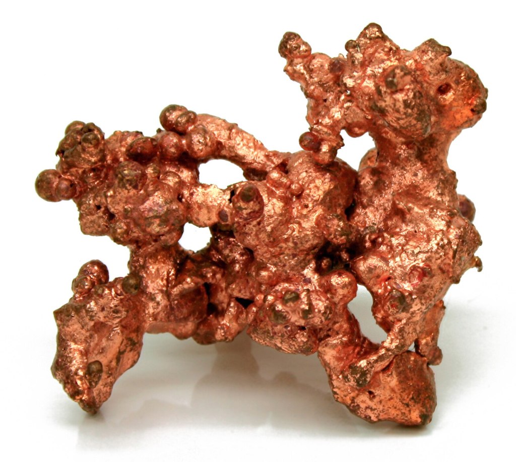 Close‑up macro photograph of a native copper specimen showing the natural metallic texture of copper metal.
