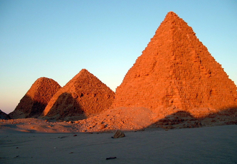 A row of ancient Nubian pyramids at Nuri, Sudan, rising from the desert landscape as royal tombs of the Kushite kings and queens from around 690–300 BCE.
