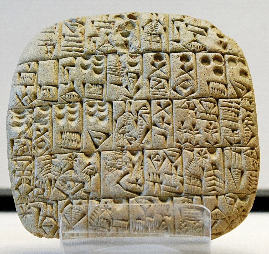 Photograph of an ancient Sumerian clay tablet inscribed with one of the earliest known written contracts, detailing the sale of a field and house in Shuruppak around 2600 BCE.