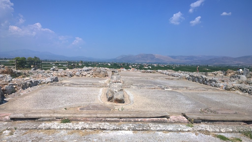 Interior view of the megaron (great hall) of the Mycenaean palace at Tiryns, showing the central hearth and surrounding architecture of the Bronze Age citadel.