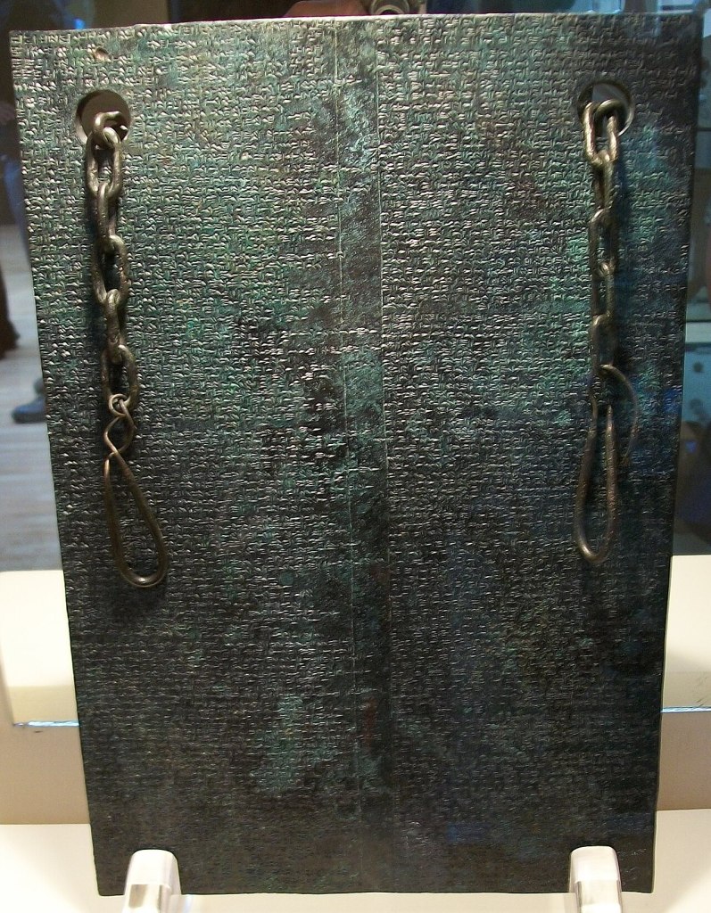 Bronze tablet inscribed in Hittite cuneiform recording the treaty between Hittite King Tudhaliya IV and King Kurunta of Tarhuntassa, discovered at the Hittite capital Hattusa and preserved as an important diplomatic text.